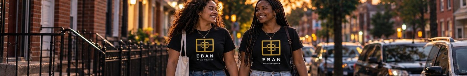 Two friends walking home together at dusk, wearing Eban shirts
